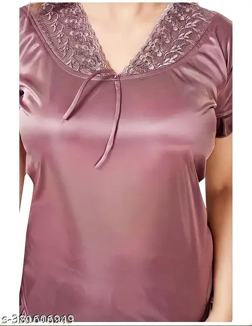 Stylish wine-colored satin nightsuit set, includes top and Patiala pants for women's wedding or honeymoon night. Solid fabric with attractive lace work. Made in India