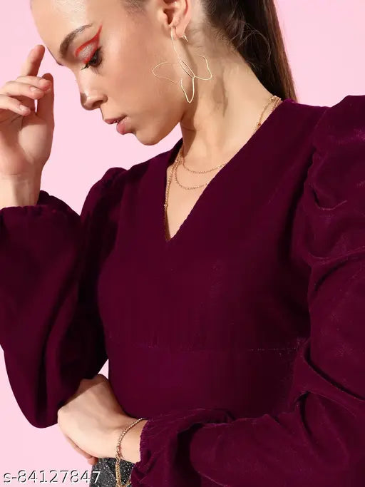 Maroon polyester puff sleeve crop top with smocked detail, solid color on fashion mannequin