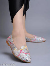Synthetic ethnic silver flat bellies for women & girls, embellished fashion ballerina flats on display
