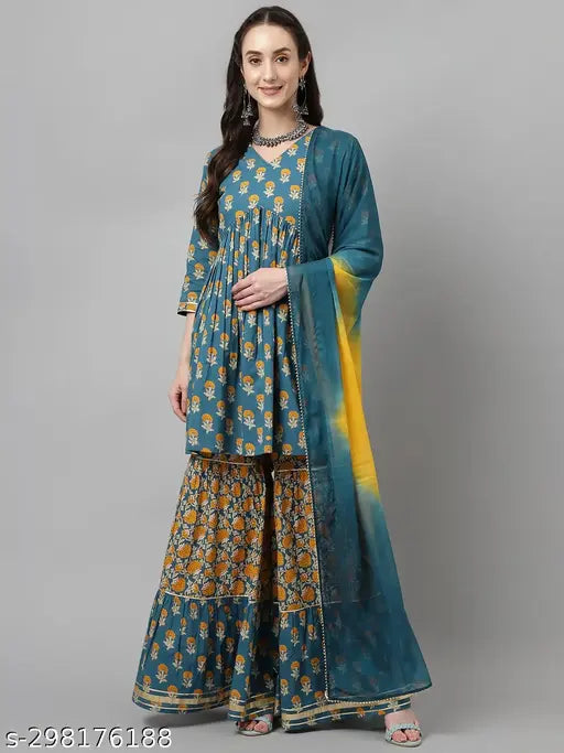 Mor peach pure cotton flared kurta with sharara and dupatta set, featuring floral print and 3/4 sleeves. V-neck, knee-length design suitable for festive occasions. Made in India