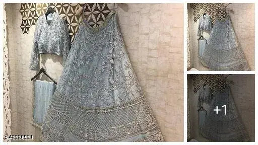 Trendy refined women's satin-net lehenga with embroidered top, net bottom, and dupatta. Semi-stitched, unstitched, free size (waist 44 inches, length 44 inches). Dry clean only. Indian craftsmanship