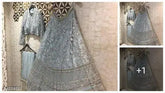 Trendy refined women's satin-net lehenga with embroidered top, net bottom, and dupatta. Semi-stitched, unstitched, free size (waist 44 inches, length 44 inches). Dry clean only. Indian craftsmanship