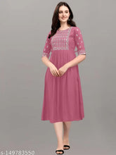 Embroidered rayon kurta in classic colors, three-quarter sleeves. Relaxed fit for casual or festive wear. Made in India