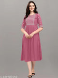 Embroidered rayon kurta in classic colors, three-quarter sleeves. Relaxed fit for casual or festive wear. Made in India