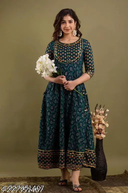 Teal blue ethnic motifs printed Anarkali kurta, rayon fabric, three-quarter sleeves, round neck, ankle length with flared hem, women's clothing on mannequin