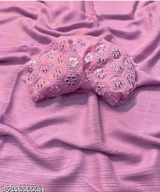 Pink Georgette saree with embroidered blouse, intricate work on display