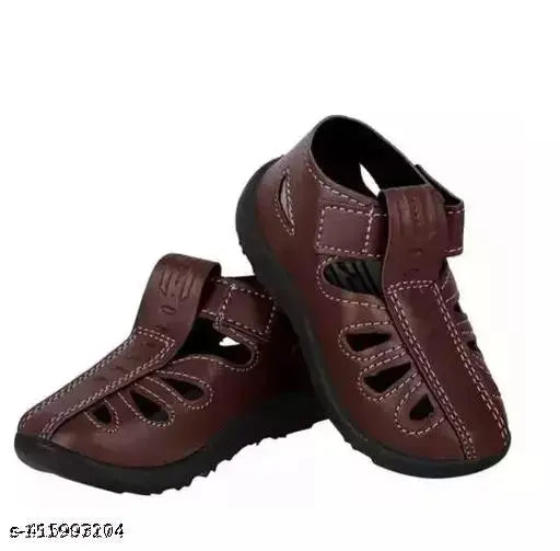 Brown synthetic leather casual sandals for kids, featuring a PVC pattern and Velcro fastening. Perfect unisex shoe for comfortable and trendy footwear. Designed with soft sole for relaxed fit, enhanced lightweight feel, and sturdy grip. Ideal size range from 9-24 months to 5 years old. Origin: India