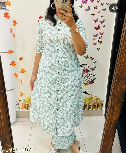 Green rayon kurta and palazzo set with short sleeves, printed net pattern on display. M, L, XL, XXL sizes available. Made in India