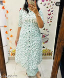 Green rayon kurta and palazzo set with short sleeves, printed net pattern on display. M, L, XL, XXL sizes available. Made in India
