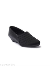 Synthetic black sneakers by Furiozz - Solid design with closed back, offering comfort and style for women