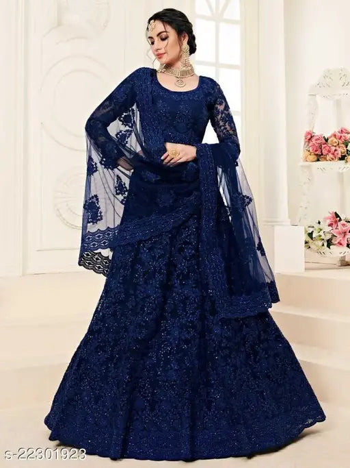 Embroidered net Lehenga top and dupatta set by Aagyeyi Ensemble, India - Choli features heavy chain embroidery" (108 characters)