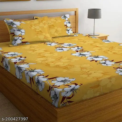Yellow premium soft cotton elastic fitted double bedsheet with two pillow covers, all around 360 elasticated. Ideal for a comfortable and durable sleep surface in summer. Dimensions: 72x78x8 inches. Made in India