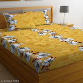 Yellow premium soft cotton elastic fitted double bedsheet with two pillow covers, all around 360 elasticated. Ideal for a comfortable and durable sleep surface in summer. Dimensions: 72x78x8 inches. Made in India