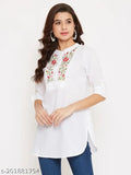 Floral embroidered rayon women's tunic with short sleeves, mandarin collar, and curved hem. White, cotton fabric, perfect for office or college wear. Made in India