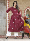 Rayon printed kurti with loose palazzo, embroidered net design on Indian bottomwear