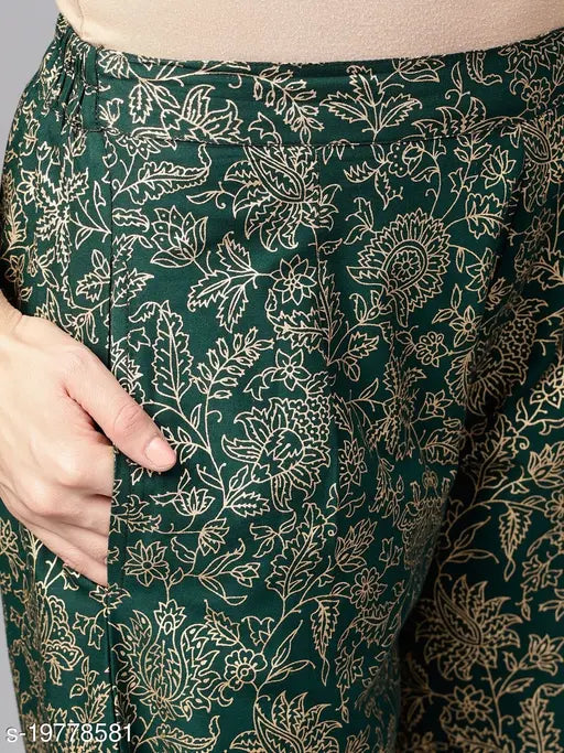Green rayon kurta set with printed net palazzo bottoms, three-quarter sleeves