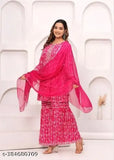 Pink cotton rayon kurta sharara dupatta set with embellishments and lacework, perfect for festive occasions. Set includes short kurta, sharara pants, and dupatta, all crafted from high-quality cotton fabric. Ideal for sizes XS, S, M, L, XL, XXL. Origin: India