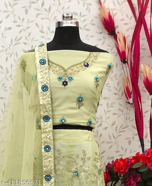 Embroidered South Indian Western wedding lehenga set in net fabric, free size. Ornate design on choli, dupatta, and skirt." (120 characters)