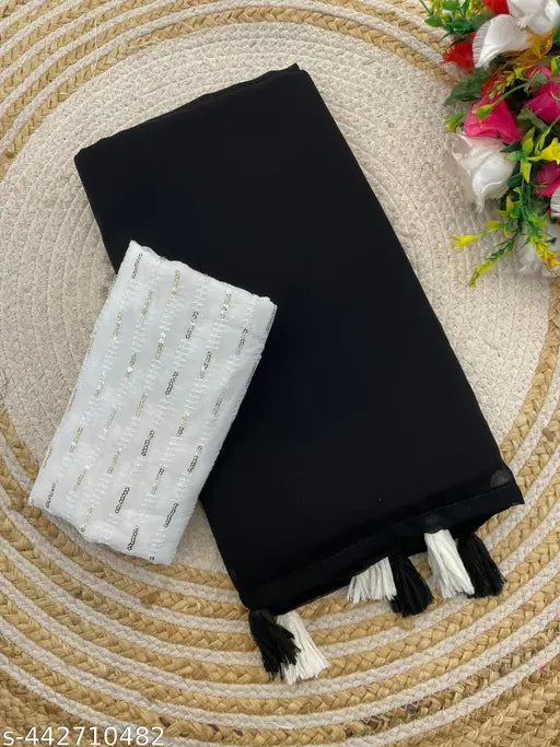 Black georgette Bollywood saree with embellished running blouse, perfect for party wear