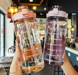 Transparent motivational pink water bottle with time marker & straw, durable & leak-proof design for gym use