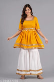 Yellow rayon sharara set with belt and neckless, featuring short sleeves and a square neckline. Radiant floral print on above-the-knee length kurta and bottomwear. Made in India
