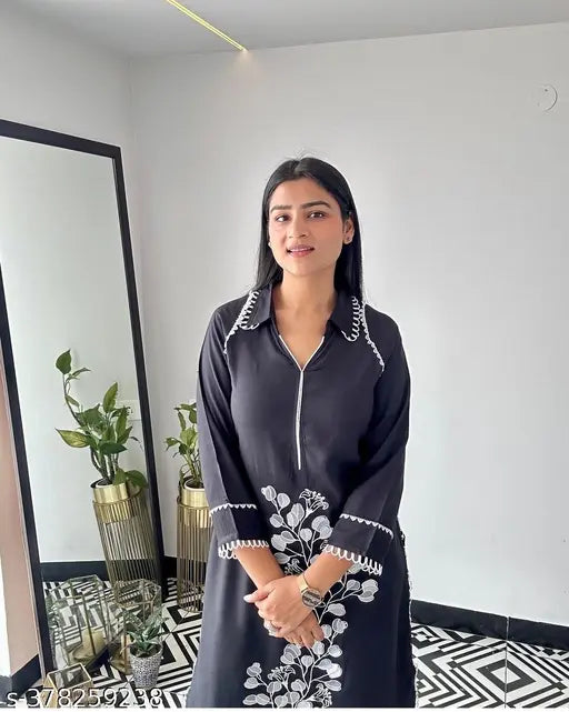 Rayon floral embroidered A-line kurta, solid green balloon fit sleeves dress on display