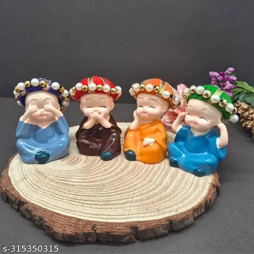 Multicolor polyresin baby monk Buddha idols (4 pieces) - Indian handcrafted home decor piece for positive energy enhancement