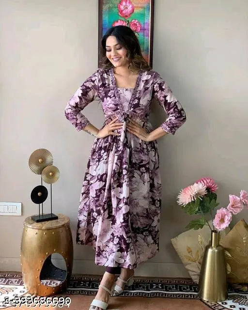 White-pink floral rayon Aliyah cut kurta, intricately embroidered with side waist tassels and motifs, for a festive gathering