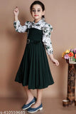 Green crepe frock with belt for girls' parties, features long sleeves and a printed net pattern. Available in sizes: 5-6Y, 6-7Y, 7-8Y, 8-9Y, 9-10Y, 10-11Y. Made in India