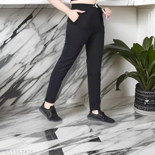 Multicolor solid grey/black cotton blend women's workout track pants, pack of 2 on display rack