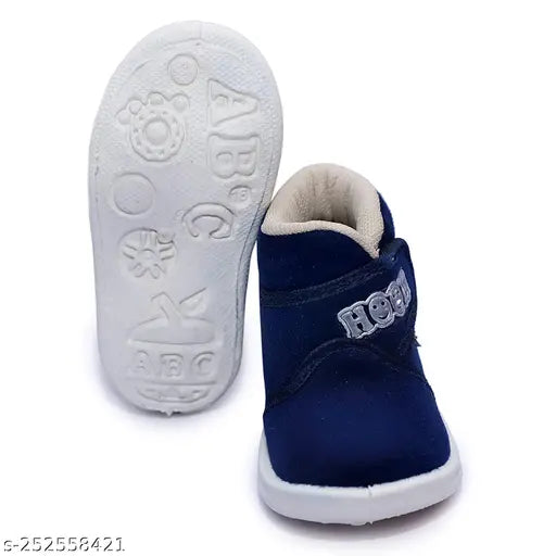 Kids canvas whistle musical sound shoes with rubber soles, embellished net pattern, ideal for boys, fastening & back detail: Velcro, insole: memory foam. Comfortable both dailywear and partywear. One pair available. Whistle function up to 2-year kids' shoes. Made in India