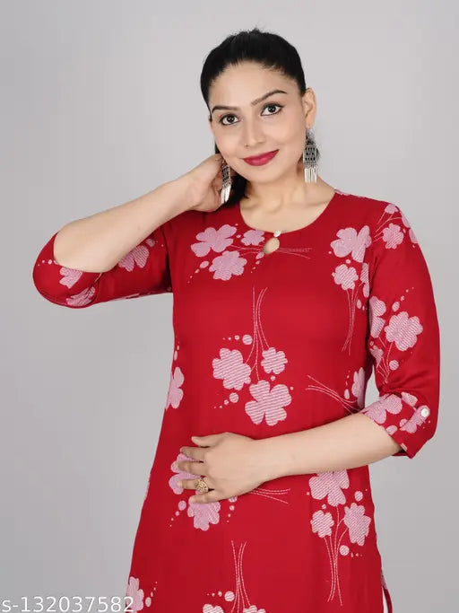 Rayon floral straight kurta, three-quarter sleeves, printed combo. Colorful women's Indian fashion wear on mannequin