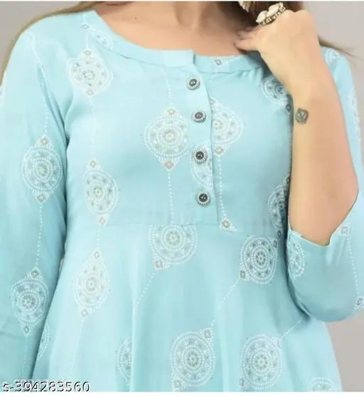 Sky blue printed cotton kurti, three-quarter sleeves, vibrant floral pattern. Single size: XS (bust size: 34 in). Made in India
