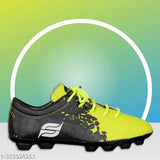 Orange PVC/Eva football shoe for boys on turf. Durable, water-resistant, lightweight with printed net design, ideal for active play and proper balance & stability