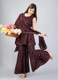 Hand-block printed rayon kurti set with sharara and dupatta, featuring gold embellishments. Made in India, XS to L sizes available