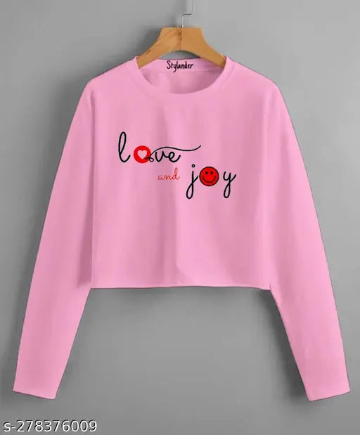 Black cotton blend crop top with long sleeves and printed net pattern, ideal for casual wear by Clothsio Women