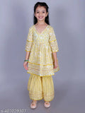 Yellow cotton paisley print Anarkali/Flared Kurta & Sharara Set for girls, featuring intricate embellishments and a flared silhouette. Ideal for special occasions or festive celebrations, available in sizes 2-3 Years to 9-10 Years (India origin)