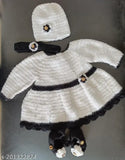 Handmade acrylic woolen baby dress with cap, embellished net pattern, and booties. Indian traditional attire for 0-6 month old girls