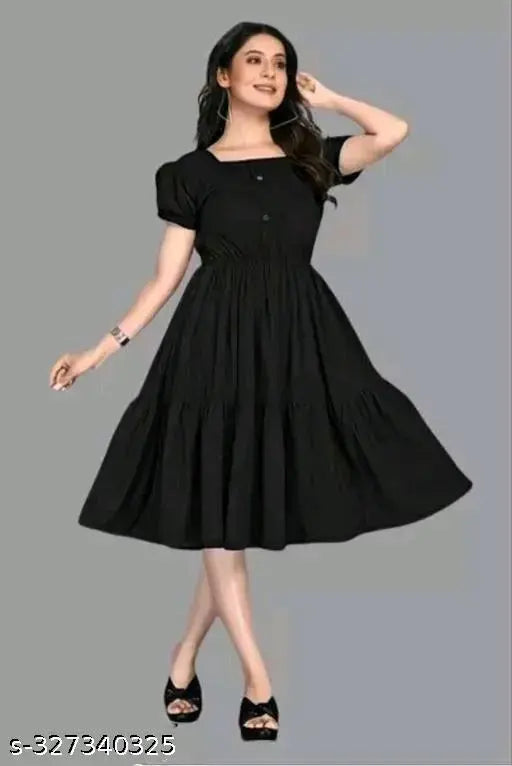 Black rayon short-sleeved party dress for women, solid design on display rack