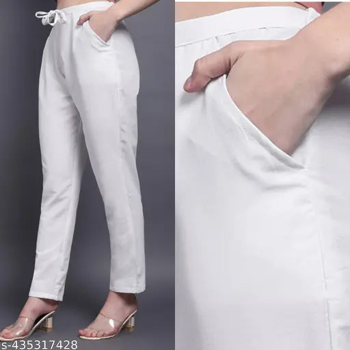 White cotton women's trousers with side pocket, drawstring, and elastic for comfort. Made in India