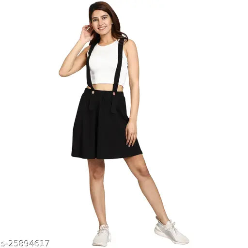 Black cotton dungaree mini skirt, mid-rise style for women and girls. Solid pattern, perfect with a white shirt or nude heels. Sizes: 28 (Waist 28in, Length 17in, Hip 18in), 30 (Waist 30in, Length 18in, Hip 19in), 32 (Waist 32in, Length 19in, Hip 20in). Made in India