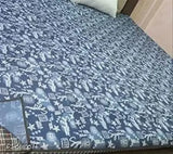 Blue printed, 200 GSM terry cotton feel PVC mattress protector for baby's king size bed. Waterproof, elastic, and breathable for hygienic and durable sleep solution