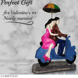 Hand-crafted, intricate polyresin Valentine Love Couple Statue on Scooter, perfect for home decor and gifting" (109 characters)