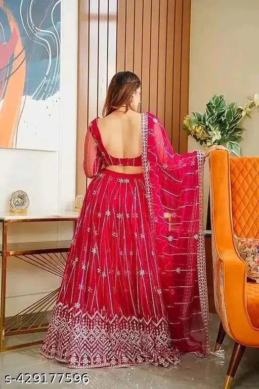 White embroidered net lehenga-choli & dupatta set for women, India. Exquisite traditional style with modern twist