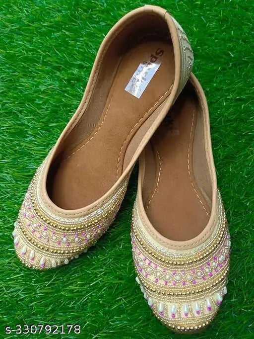 Synthetic slip-on bellies ballerinas and colorful Punjabi mojaris, Indian handcrafted footwear on display