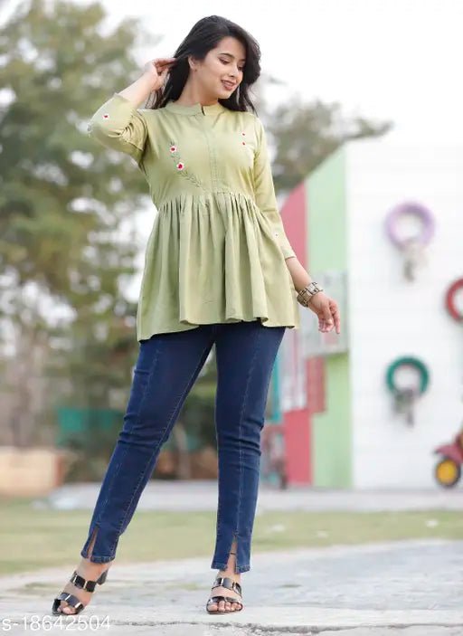 Light green rayon embroidery crop top with three-quarter sleeves, India-made fashionable women's clothing on mannequin