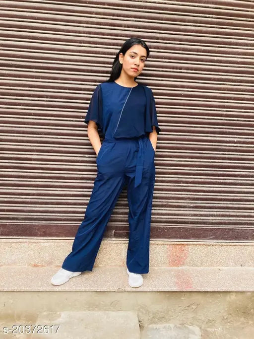 Stylish crepe jumpsuit for women in solid net pattern. XS-L sizes available from India