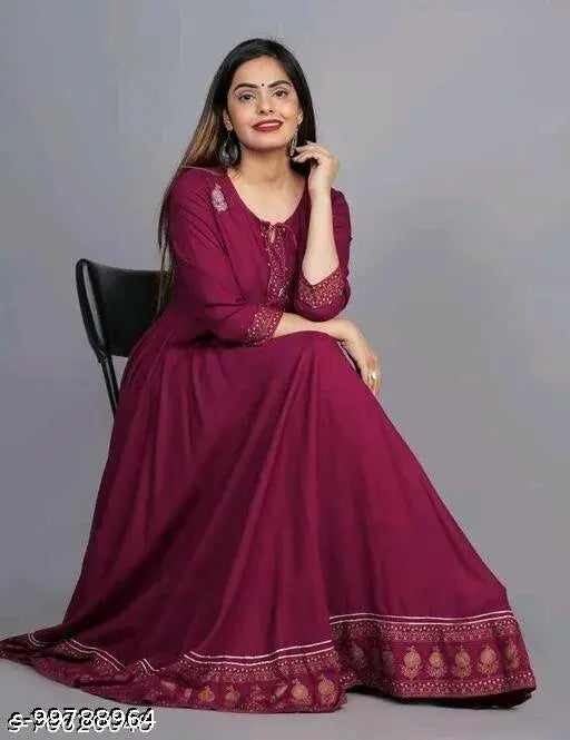 Purple flared rayon kurti with tussles, three-quarter sleeves, solid design. M size (bust: 38in), L size (bust: 40in), XL size (bust: 42in), XXL size (bust: 44in). Indian ethnic women's fashion