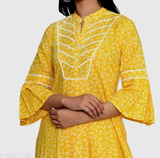 Yellow Rayon Kannahi A-Line Kurta with ethnic motif print, three-quarter sleeves, calf length, mandarin collar, and side slits. Indian women's fashion wear on model