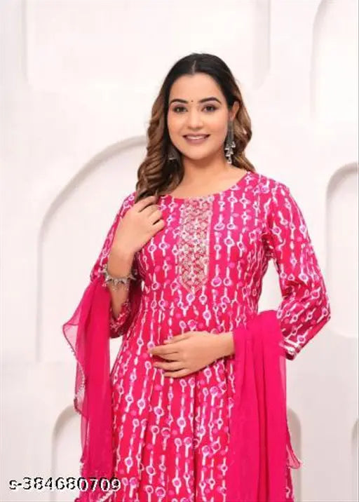 Rayon kurta sharara dupatta set with pink floral embellishments, pack of 3 for festive celebrations. High-quality cotton material ensures comfort and breathability. Sizes: XS, S, M, L, XL, XXL. Made in India
